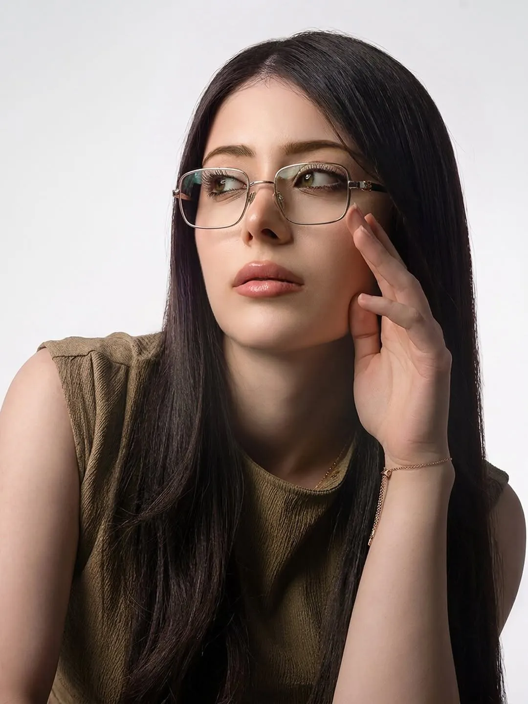 Woman in a fine gold-tone rectangular optical frame